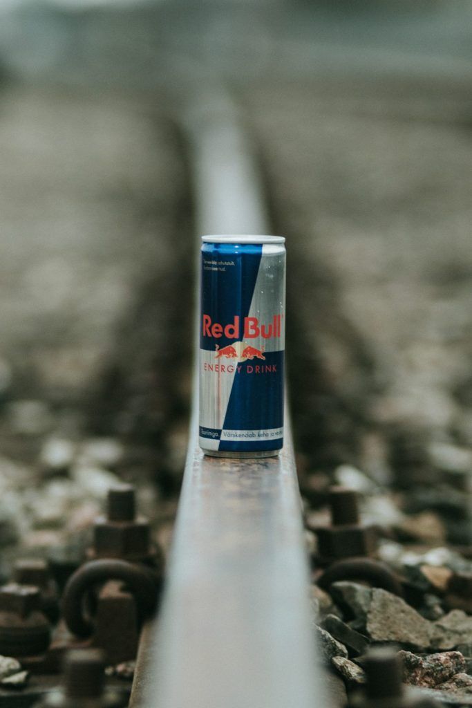 Red Bull energy drink on train tracks